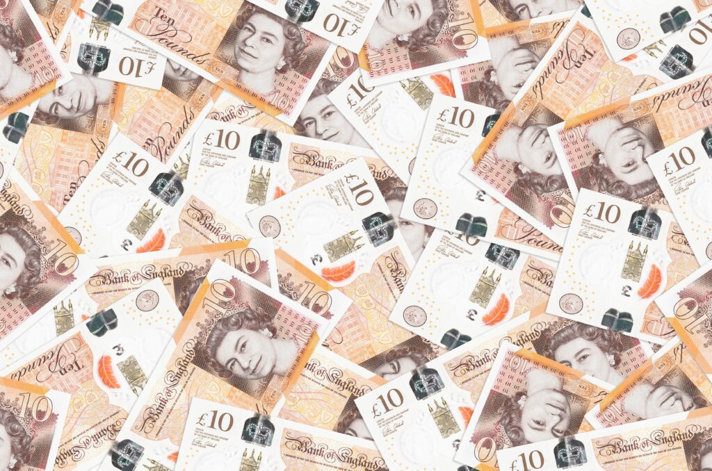 A Skilled Worker visa applicant reviewing bank statements and financial documents to meet UK proof of funds requirements in 2025.