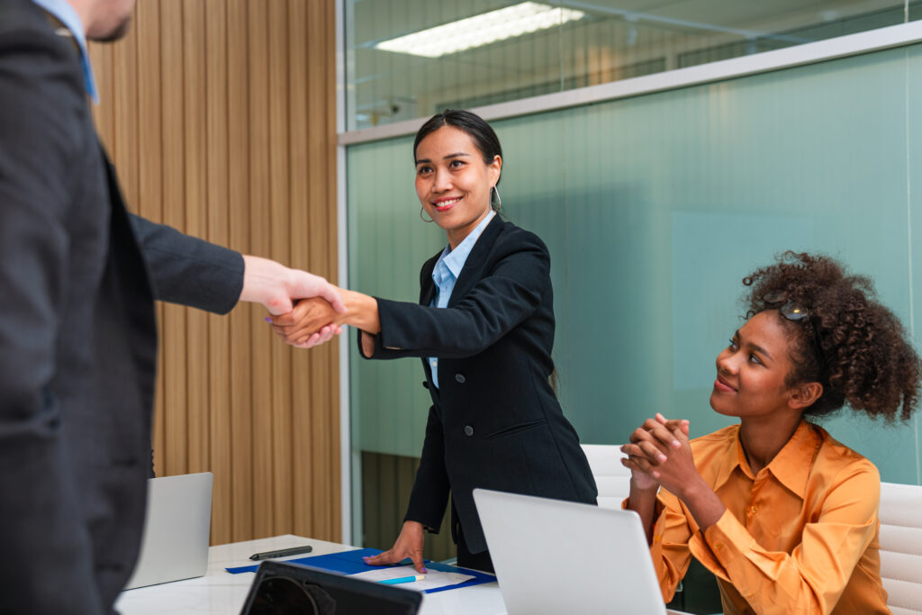 Illustration of a UK work visa holder reviewing job offers from multiple employers, symbolising sponsor changes under the Skilled Worker visa.
