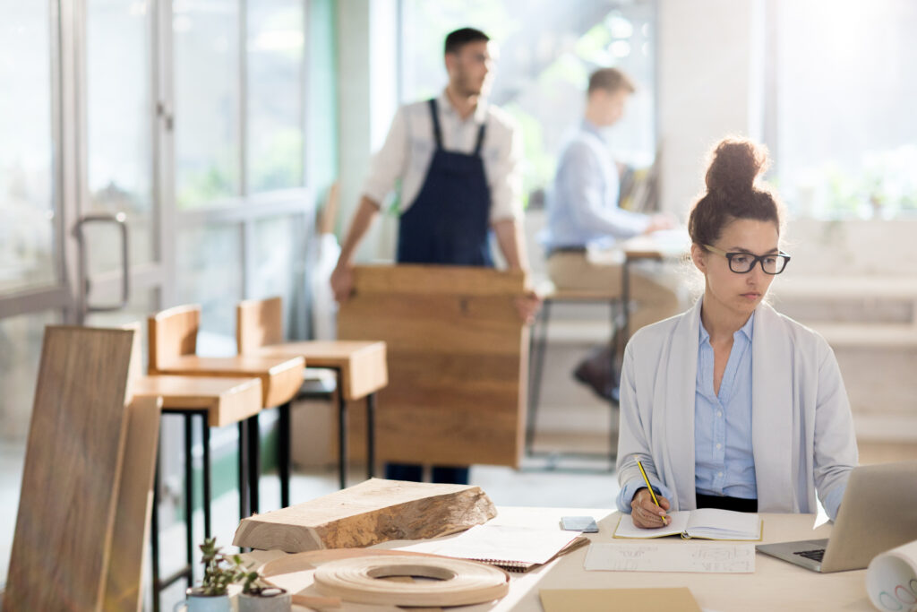 A business team reviewing workforce planning documents, symbolising how UK employers are preparing for the new Temporary Shortage List in 2025.