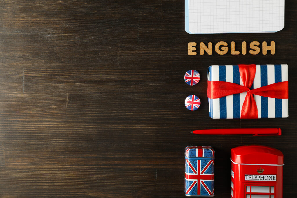 Close-up of a student holding an English test preparation book and passport, symbolising the new B2 English requirement for UK visa applicants in 2025.