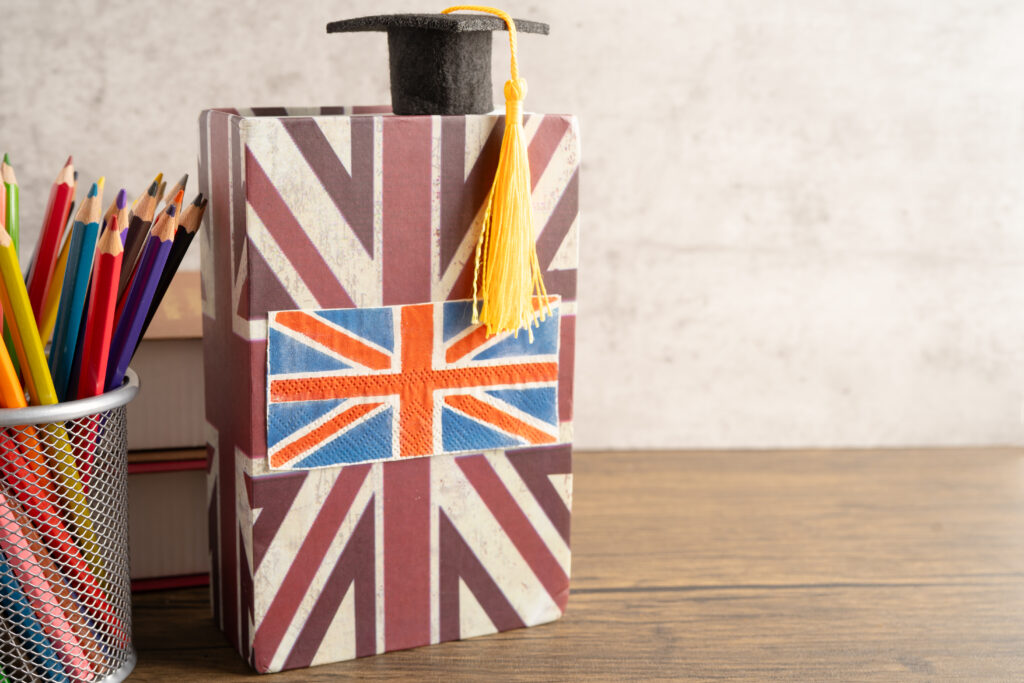 A Skilled Worker visa holder in the UK balancing office work with evening university study.