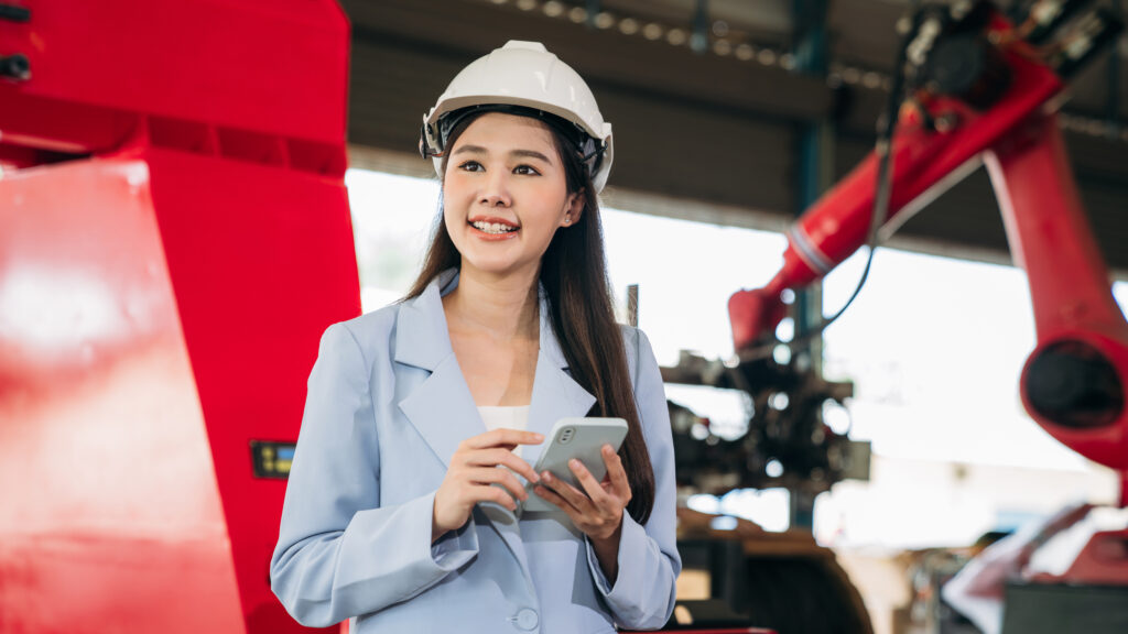 Engineering and Manufacturing Careers for Skilled Worker Applicants – a concept image showing engineers and technicians working on advanced machinery and infrastructure, symbolising UK visa opportunities in 2025.