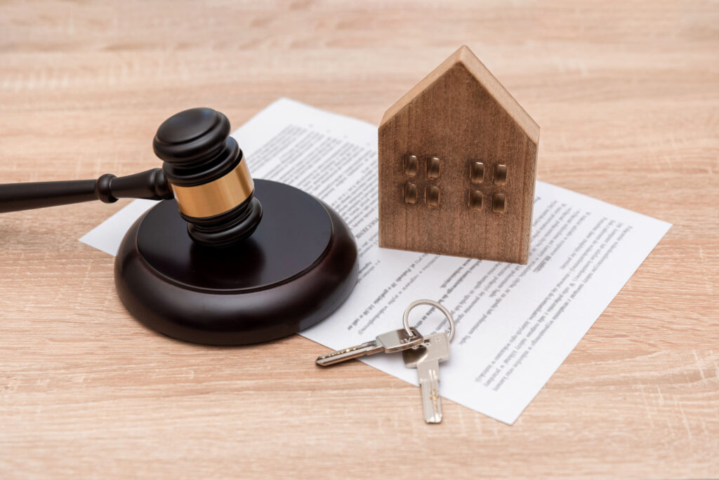 A professional reviewing immigration documents at a desk in a UK office, symbolising continuous residence and Skilled Worker ILR settlement eligibility in 2025.