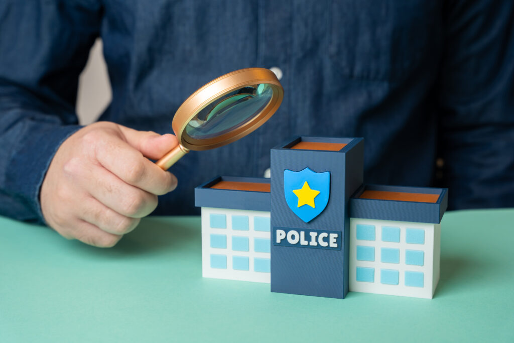 A formal graphic showing a UK passport, a security clearance checklist, and a police badge icon, symbolising the transition from police registration to modern security vetting processes in 2025.