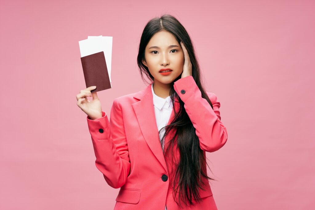 A concerned professional reviewing UK visa documents after losing their sponsored employment.